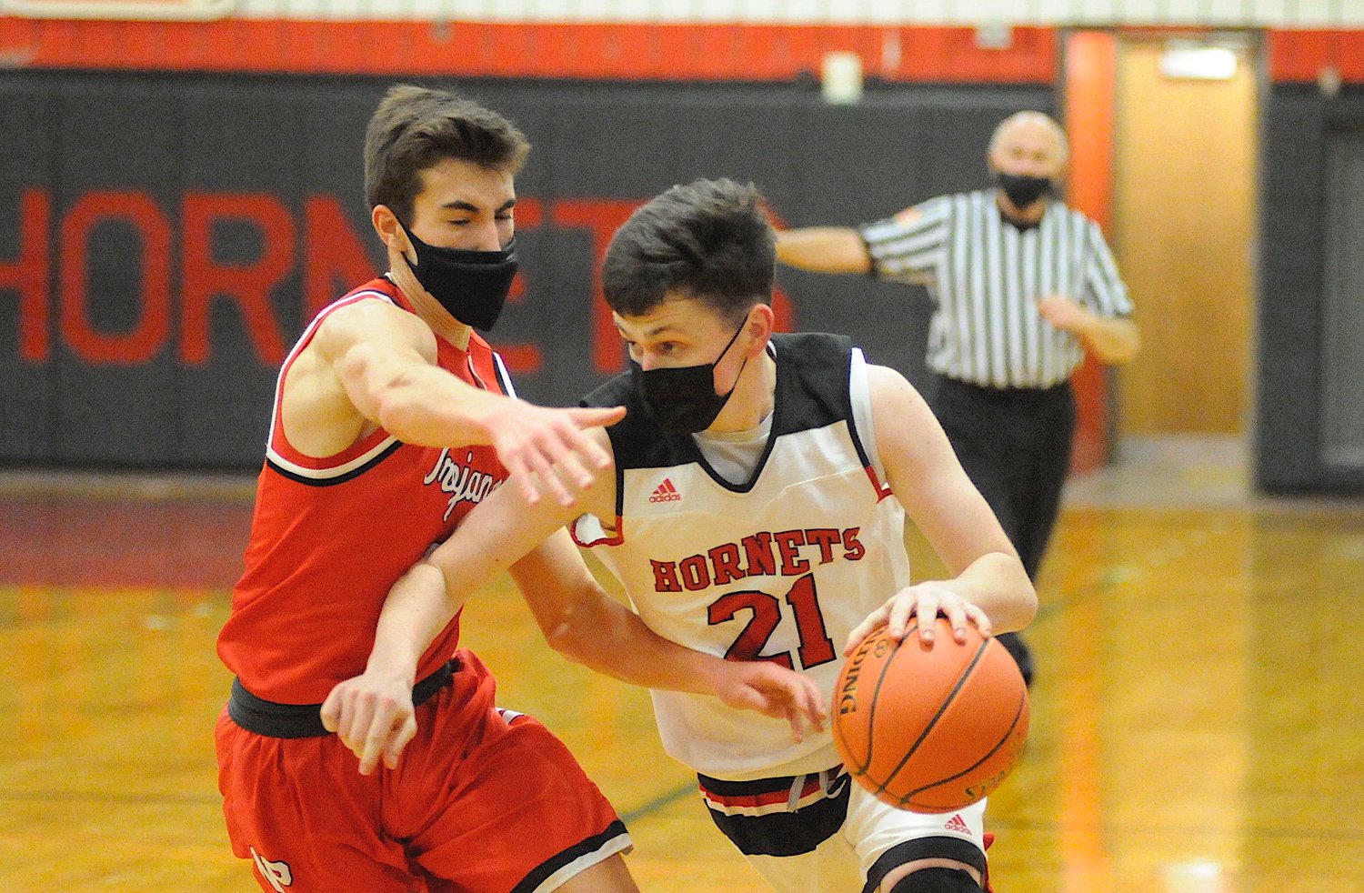 Not to be denied. Honesdale’s senior Connor Coar sprints to the paint, as Matt Kowalski defends for the Trojans.